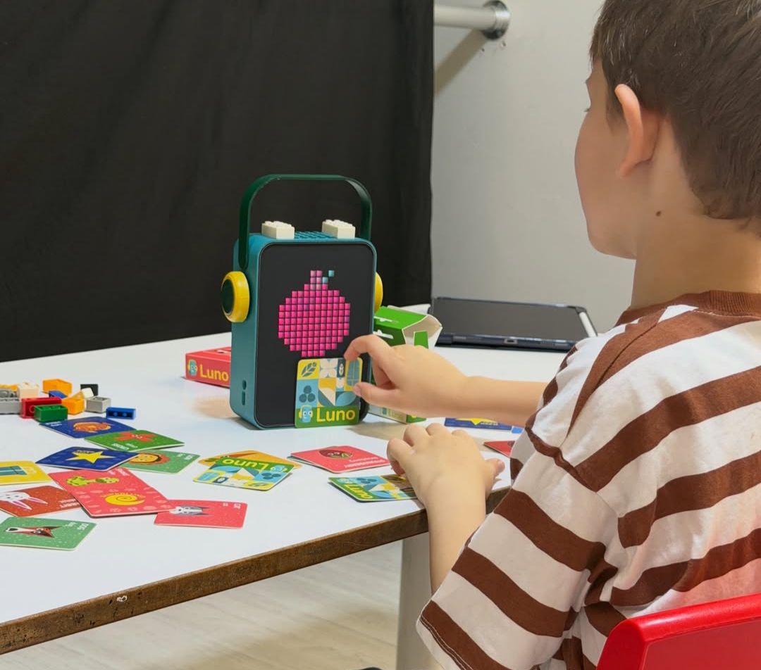 Child playing with LunoBox cards